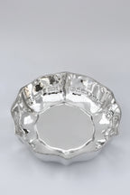 silver bowl with wavy edges