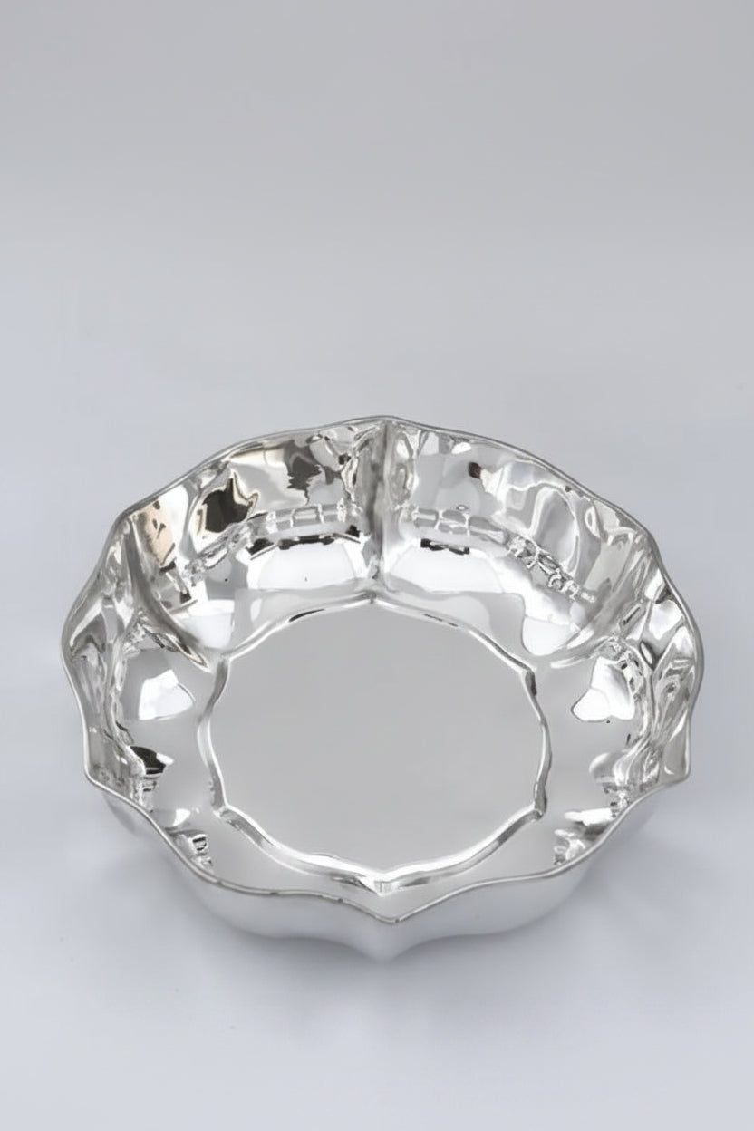 silver bowl with wavy edges
