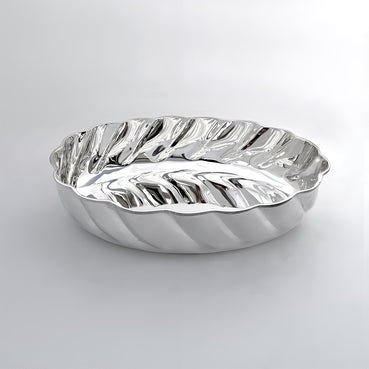 Silver wavy bowl on a light gray background