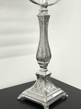 Silver Menorah with eight candles on a white background