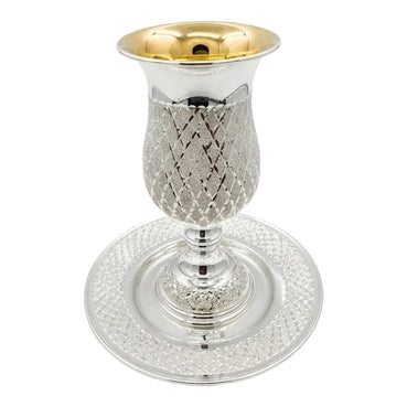 Silver kiddush cup with gold top and matchng tray on a white background