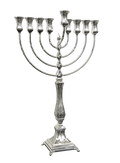 Silver Menorah with eight candles on a white background