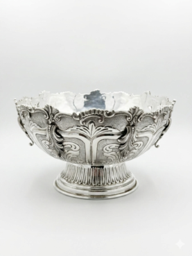 Decorative silver bowl and natla set with intricate designs on a white background