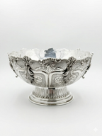 Decorative silver bowl and natla set with intricate designs on a white background