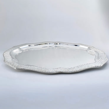 Silver platter on a light gray background