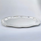 Silver platter on a light gray background