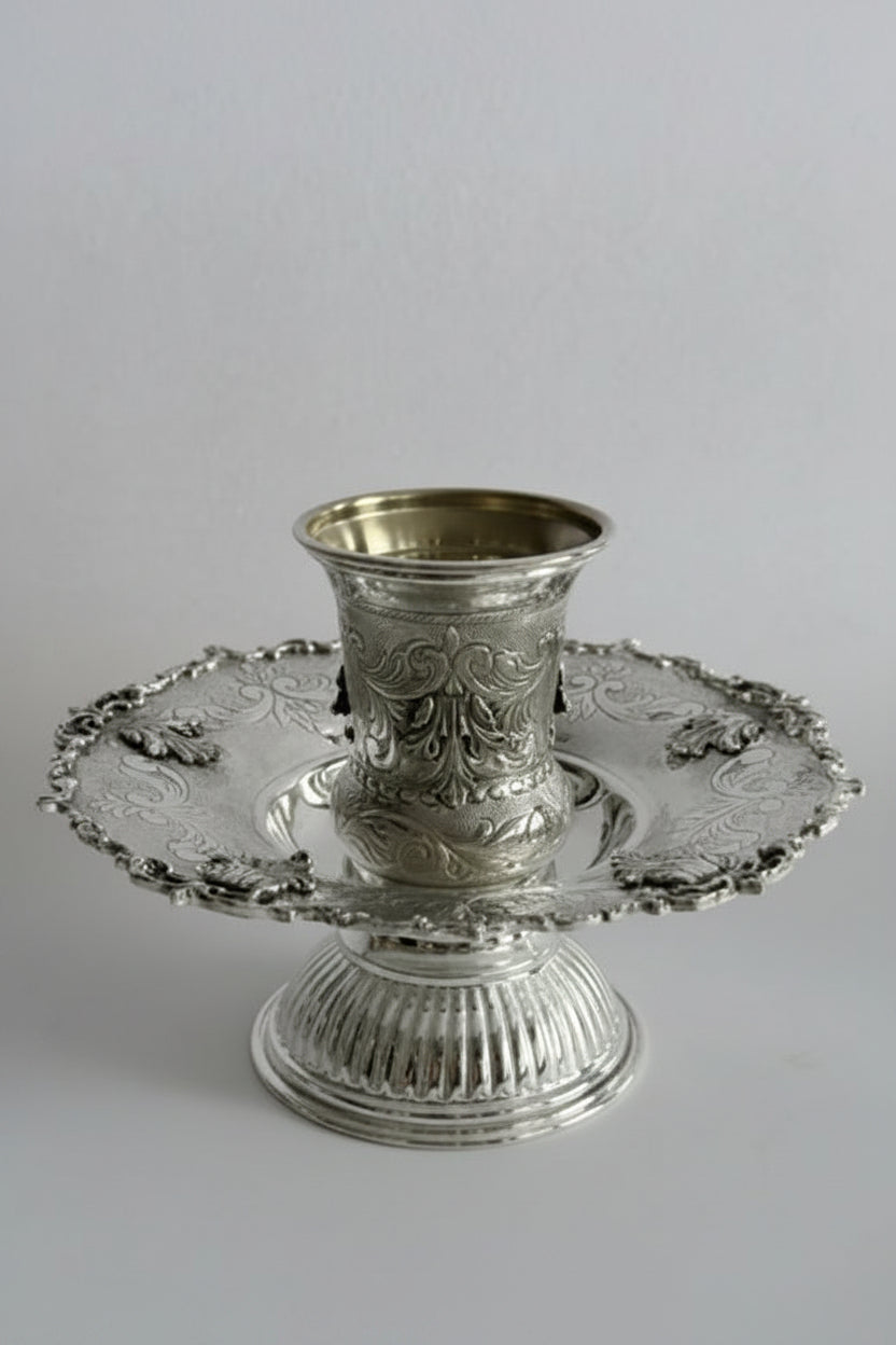 Silver cup and tray mayim achronim  with intricate designs on a white background
