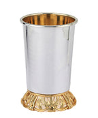 Silver and gold cup with a matching tray on a white background