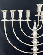Silver Menorah on a black background