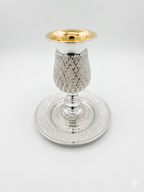 Silver kiddush cup with gold top and matchng tray on a white background