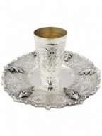 Silver kiddush cup and tray on a white background