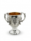 Decorative silver bowl and natla set with intricate designs on a white background