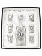 A crystal glass decanter with6 matching shot glasses by hadad bros silverware.