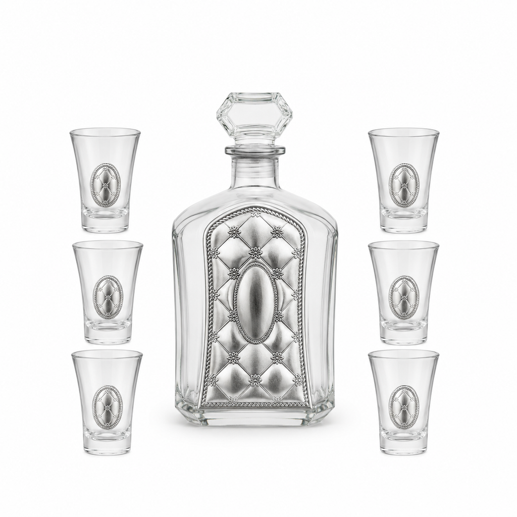 A crystal glass decanter with a stopper and six matching shot glasses,by hadad bros silverware.