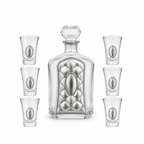 A crystal glass decanter with a stopper and six matching shot glasses,by hadad bros silverware.
