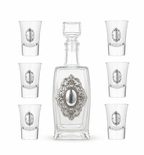 A crystal glass decanter with6 matching shot glasses by hadad bros silverware.