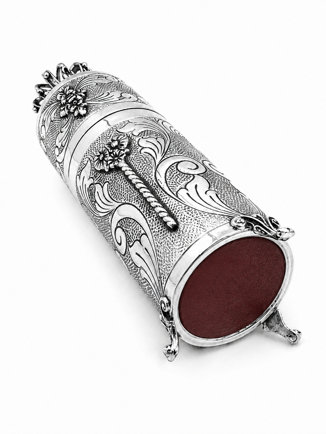 A silver Kiddush cup with an ornate floral engraving pattern, shown on a matching silver Kiddush plate by hadad bros silverware