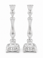 Two pure silver 925 candlesticks on a white background