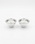 Two small polished metal cup-like holders with flared rims, shown side by side by hadad bros silverware