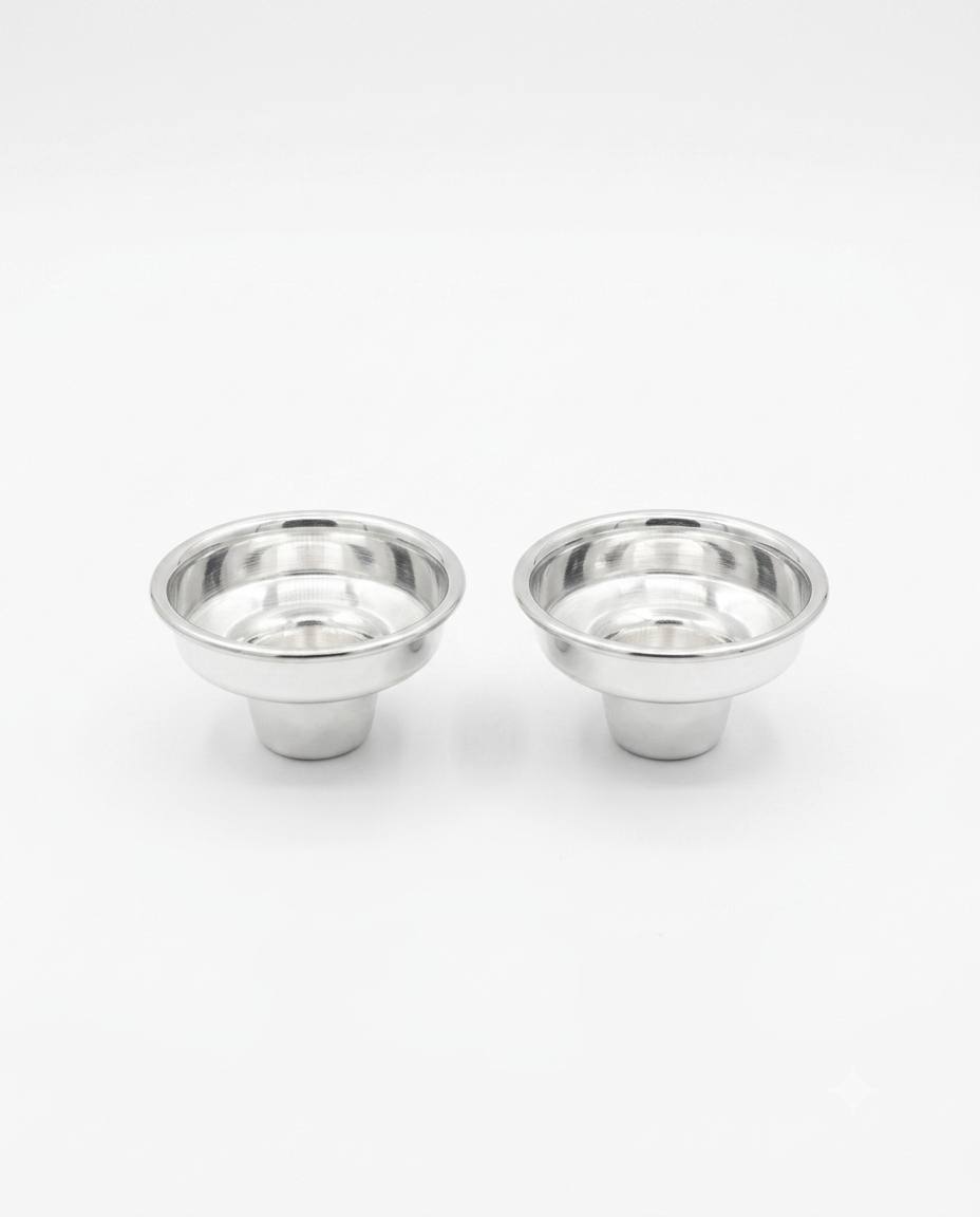 Two small polished metal cup-like holders with flared rims, shown side by side by hadad bros silverware