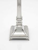Two silver 925 candlesticks on a white background