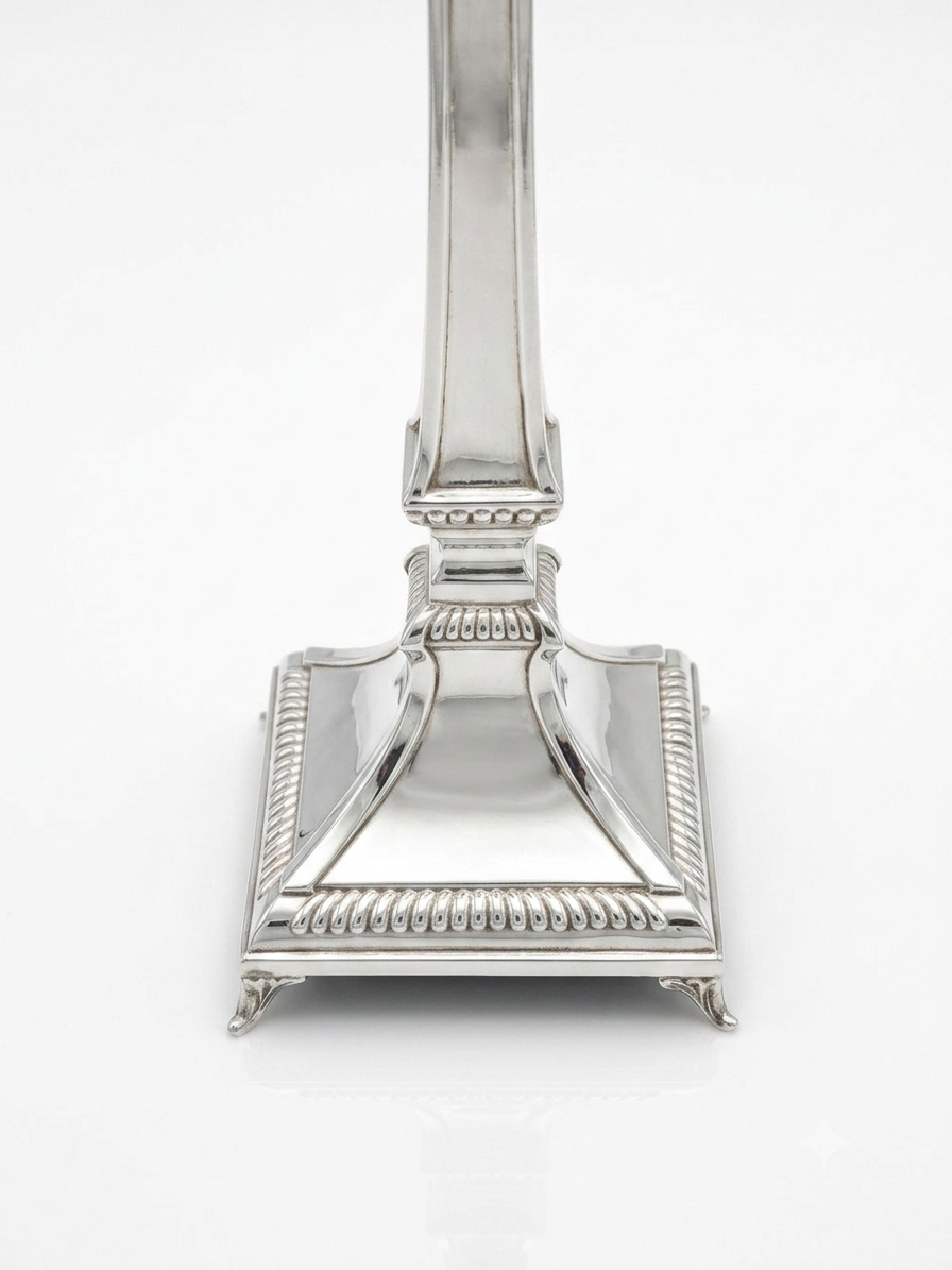 Two silver 925 candlesticks on a white background