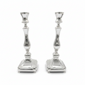 Two sterling silver 925 candle holders on a white background