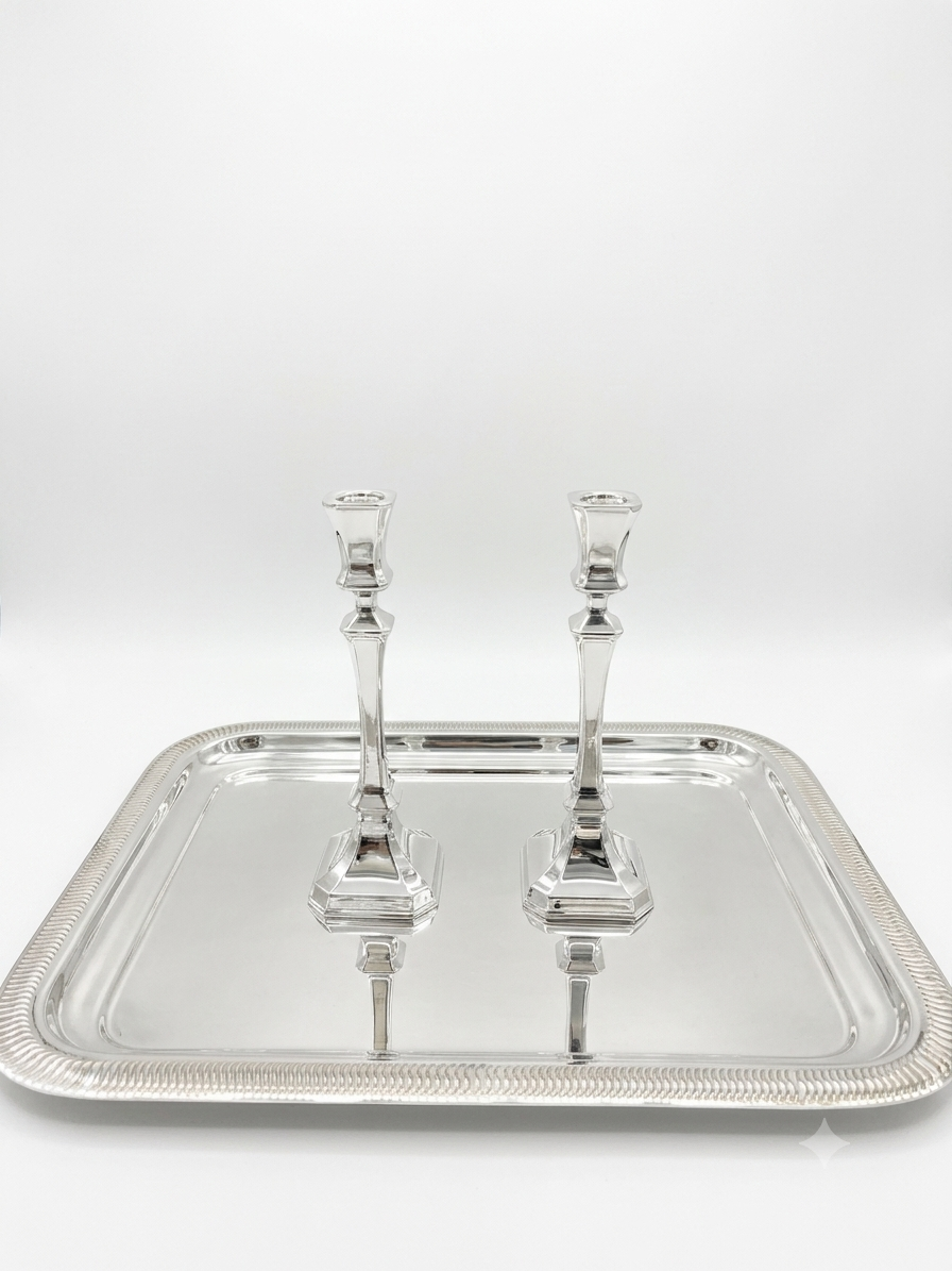 Two sterling silver 925 candlesticks on a white background