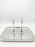 Two sterling silver 925 candlesticks on a white background