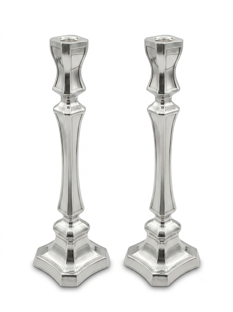 Two silver candlesticks on a white background