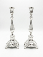 Two pure silver 925 candlesticks on a white background