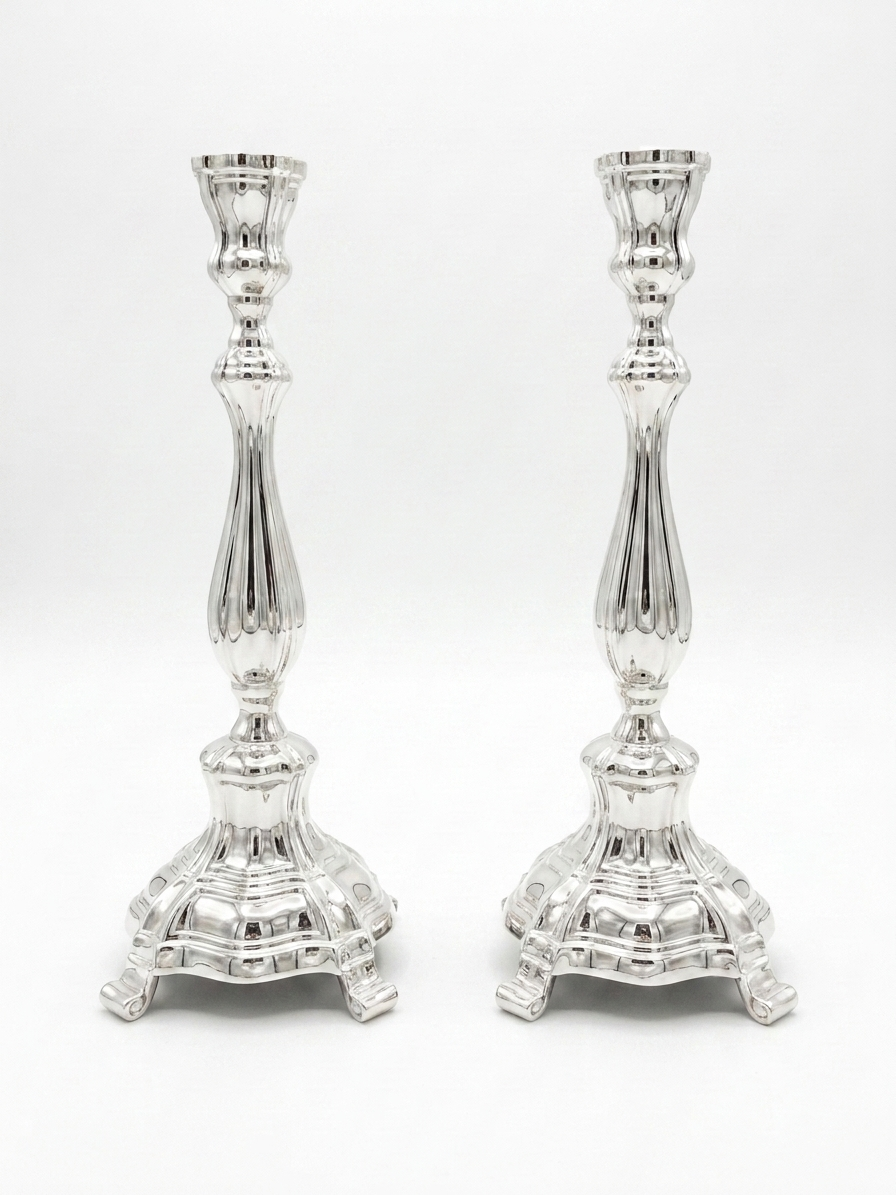 Two pure silver 925 candlesticks on a white background