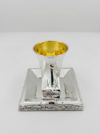 Hadad bros A silver Kiddush cup with a gold interior, set on a matching square silver tray with a decorative Jerusalem cityscape border