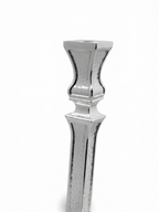 A pair of ornate silver candlesticks with detailed textured engravings and flared bases, shown against a plain white background. hammered silver candlesticks by hadad bros silverware