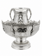 An ornate silver netilat yadaim bowl, double handles, and a fluted base by hadad bros silverware