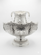 Decorative silver bowl and natla set with intricate designs on a white background