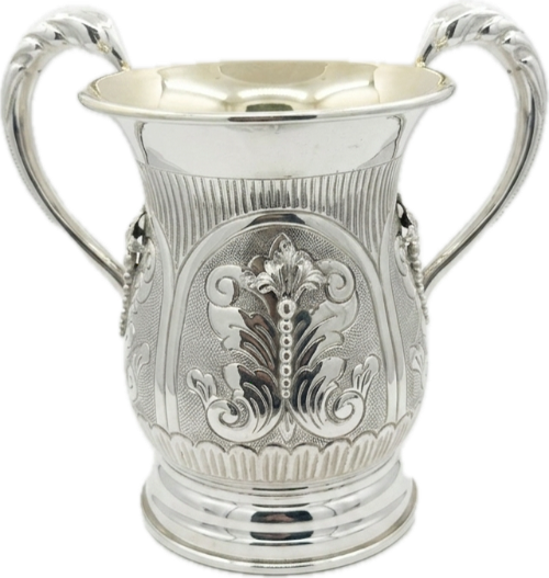 Silver natla cup with intricate designs on a white background