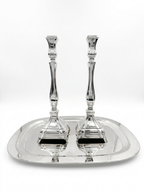 A pair of silver candlesticks with fluted stems and square bases, by hadad bros silverware