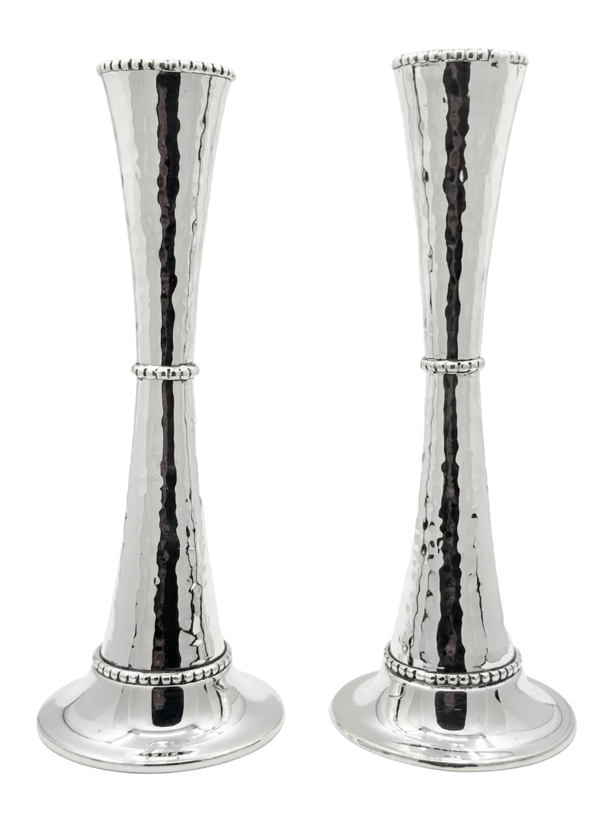 Pair of silver candlesticks holders on a white background