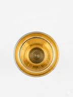 Silver goblet with gold interior on a white background