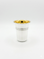 Silver cup with gold interior on a white background