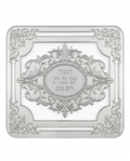 Decorative silver challah tray with intricate designs and Hebrew text on a white background