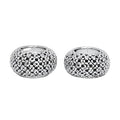 Pair of silver table candlesticks with textured design on a light gray background