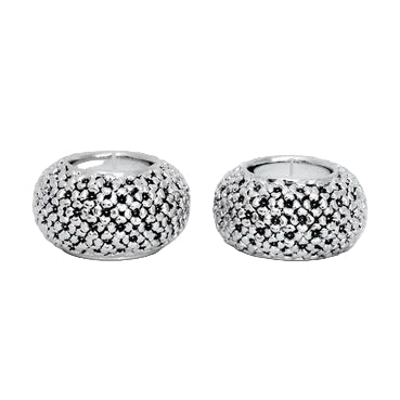 Pair of silver table candlesticks with textured design on a light gray background
