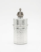 Silver toothpick holder with decorative top on a white background