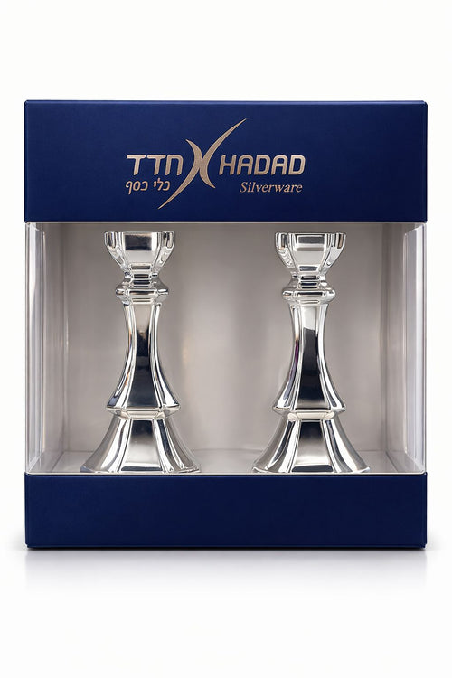 Two silver candlesticks in a TTN Hadad branded box on a white background