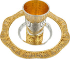 Silver and gold kiddush set on a white background
