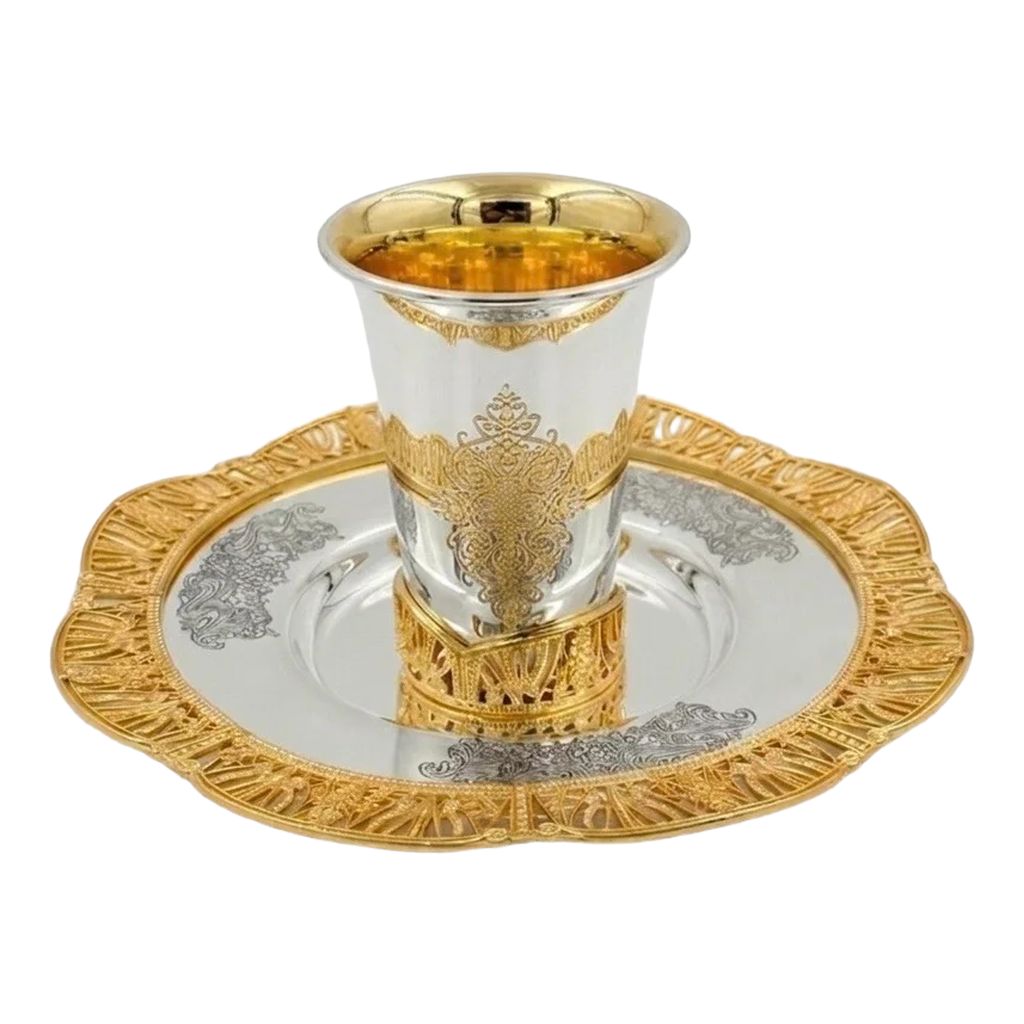 Silver and gold kiddush set on a white background
