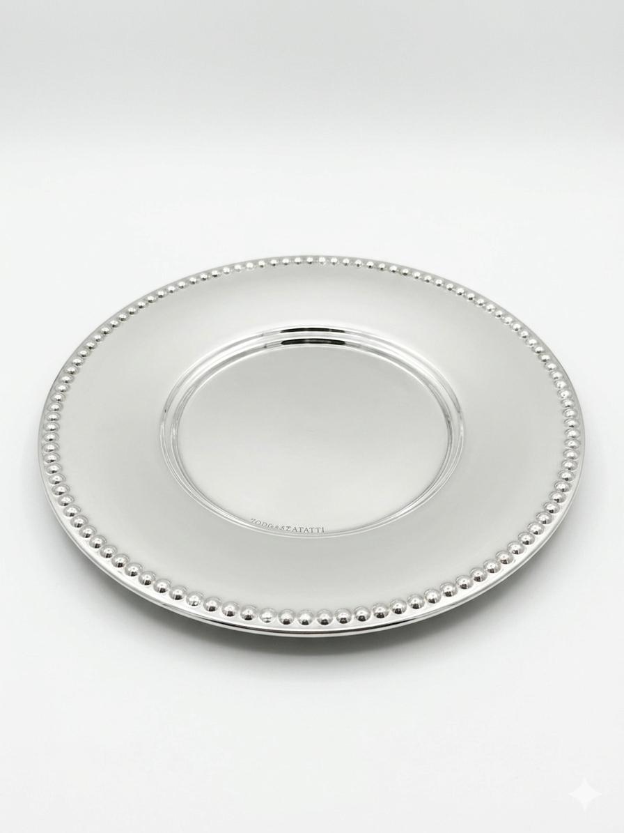 Silver tray plate with beaded edge on a white background