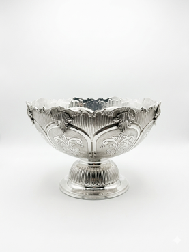 Decorative silver bowl and natla set with intricate engravings on a white background
